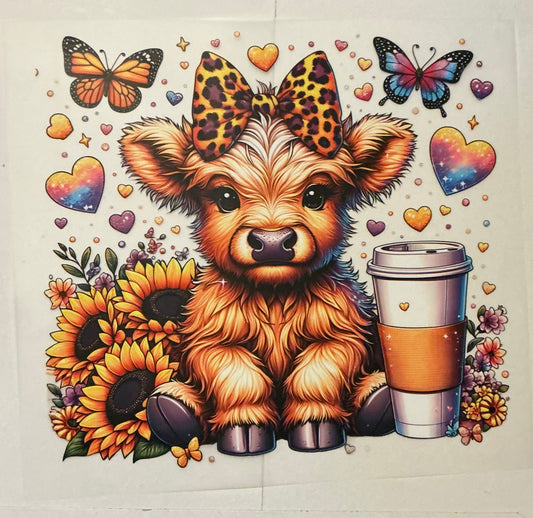Cow with coffee and sunflowers