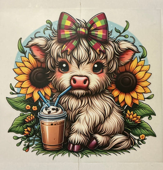 Cow with bow and coffee and sunflowers