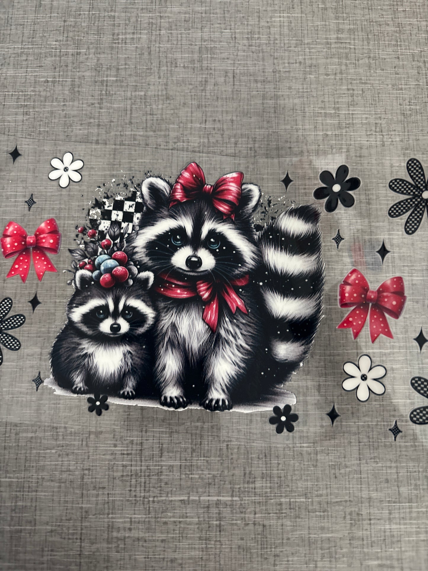 Raccoon with bows