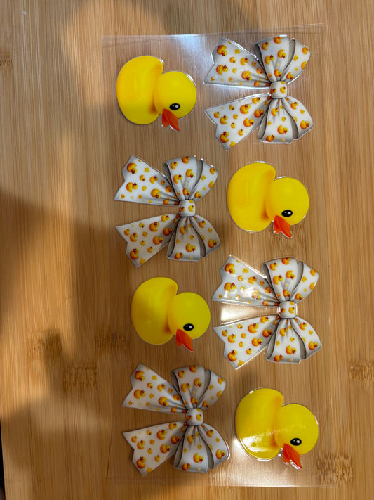 rubber ducks with white bows